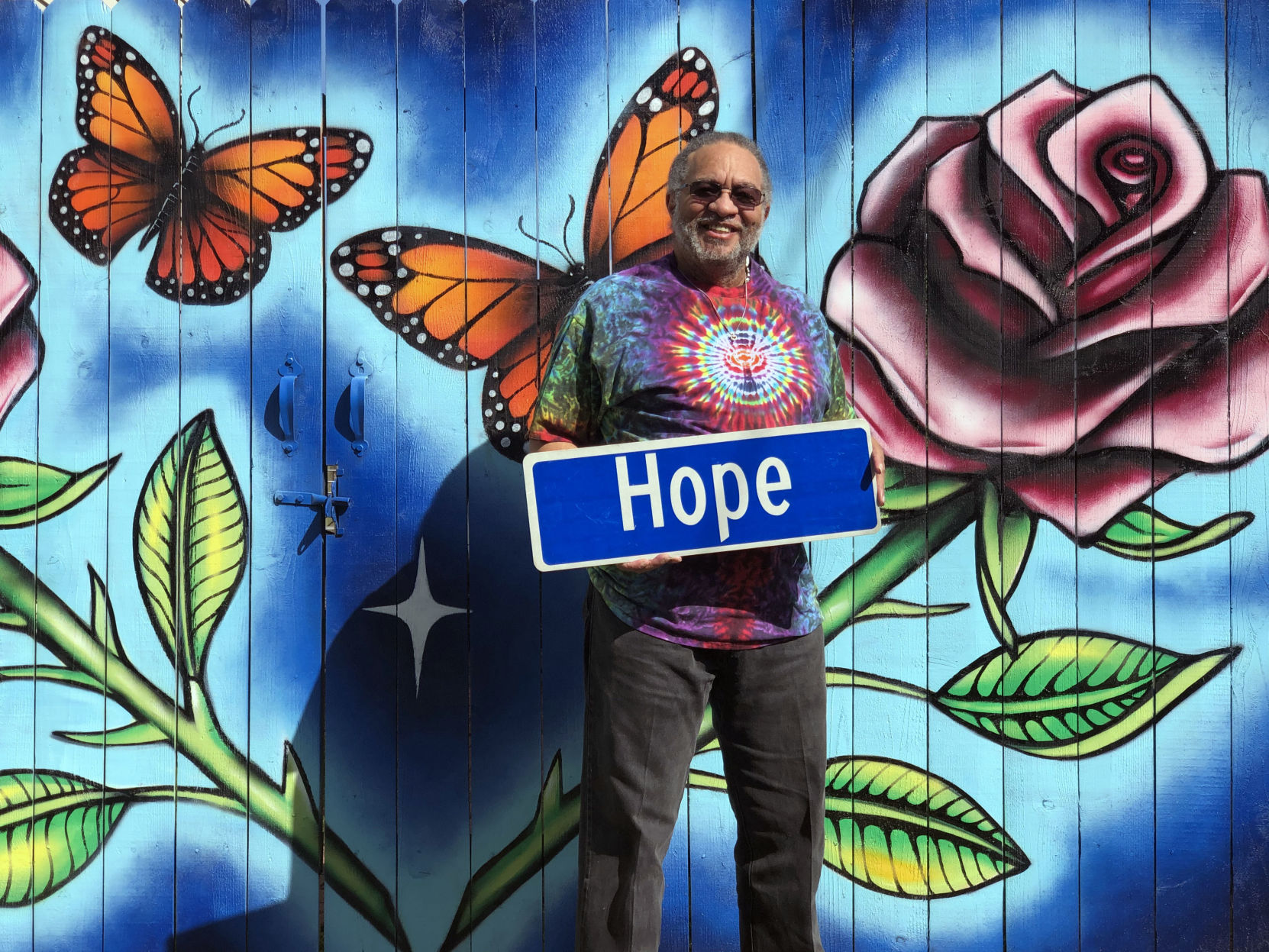 George Porter Jr. with Hope Street sign.jpg